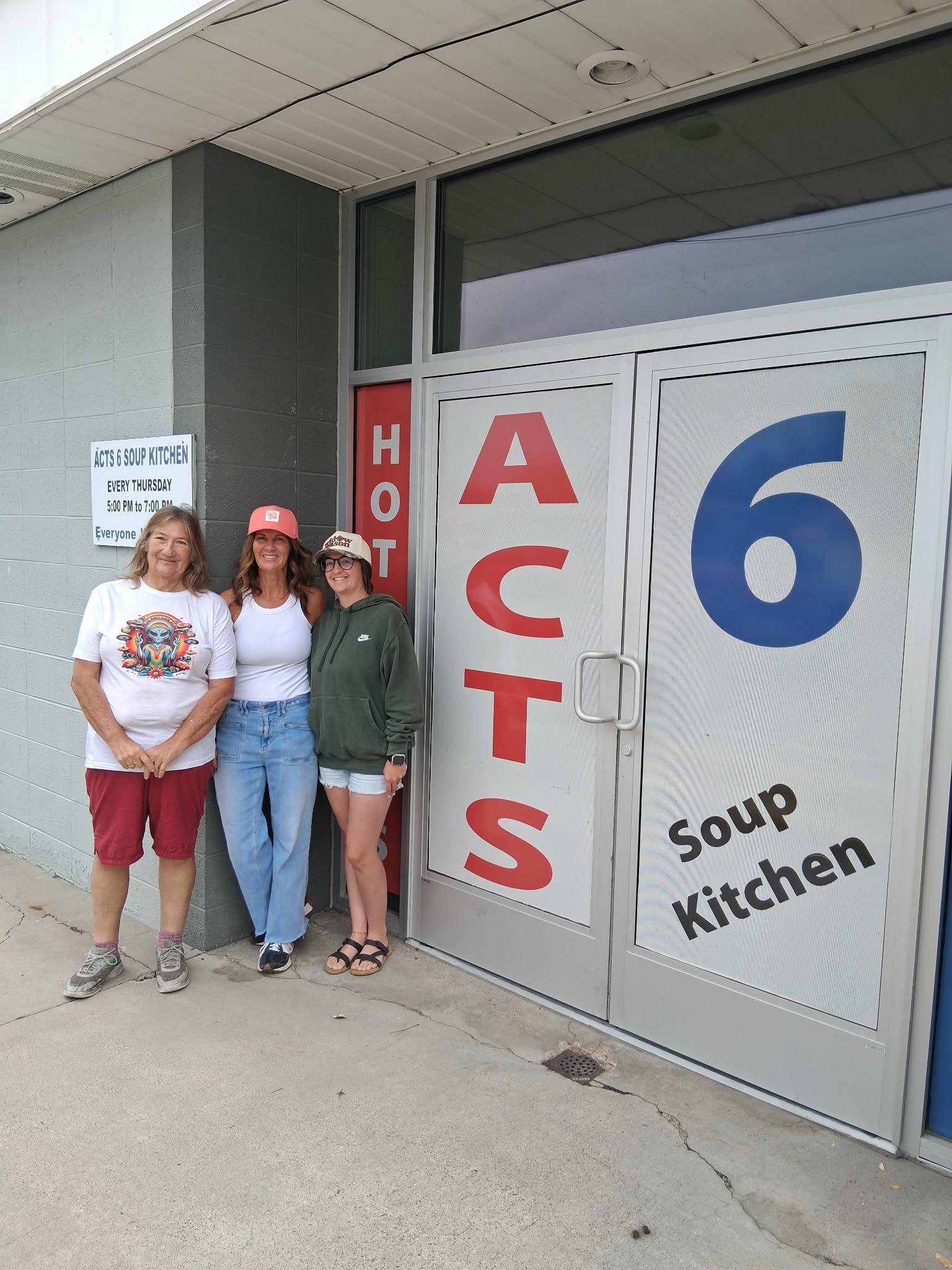 soup kitchen board members with STS Trucking check